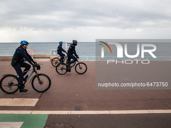 the police controls the lockdown, in Nice, France, on February 27, 2021 -by bicycle along the promenade (