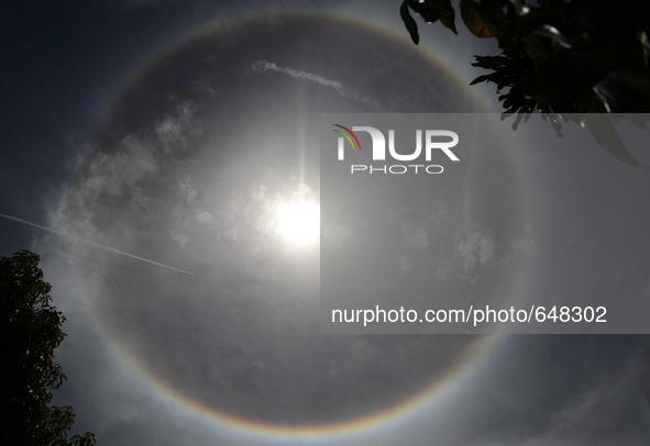 A sun halo is seen in Bangkok, Thailand on June 21, 2015. 