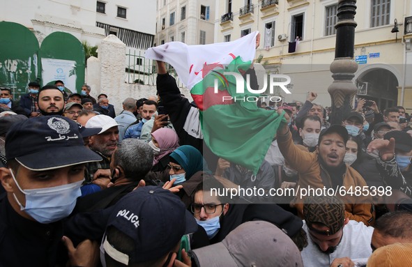 Algerian demonstrators march during an anti-government demonstration called by Algerian students, in Algiers, Algeria on March 2