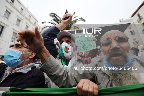Algerian demonstrators march during an anti-government demonstration called by Algerian students, in Algiers, Algeria on March 2