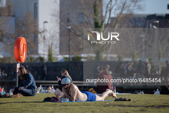   People soak up the spring sun, despite the national lockdown, at New Islington Marina in Manchester city centre on Tuesday 2nd March 2021....