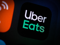 The Uber Eats application icon is seen on an iPhone home screen in Warsaw, Poland on March 3, 2021. (