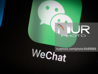 The WeChat application icon is seen on an iPhone home screen in Warsaw, Poland on March 3, 2021. WeChat is a Chinese developed messaging app...