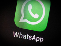 The WhatsApp application icon is seen on an iPhone home screen in Warsaw, Poland on March 3, 2021. (