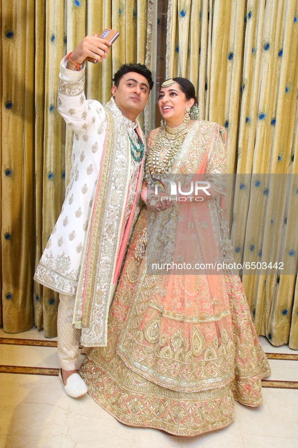 Bollywood filmmaker JP Dutta's newlywed daughter Nidhi Dutta and son-in-law Binoy Gandhi  poses for a photograph during the wedding ceremony...