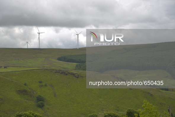 Turbines at the Todmorden Moor wind farm, on Sunday 21st June 2015, generating electricity for the United Kingdom's energy supply network kn...