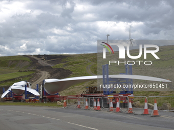 Lorries delivering turbine blades to a wind farm construction site near the towns of Bacup and Todmoreden in the Calderdale area of West Yor...