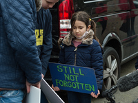 LONDON, UNITED KINGDOM - MARCH 08, 2021: Richard Ratcliffe's daughter Gabriella (6) reads support messages during a protest outside the Emba...