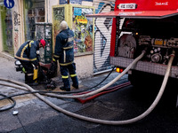 Fire extinguishing at a building in Perikleous street in the center of Athens, Greece, March 12, 2021. (