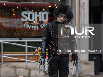 LONDON, UNITED KINGDOM - MARCH 18, 2021: Johnny Depp's supporter dressed as the movie character Edward Scissorhands arrives at the Royal Cou...