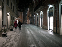 People  during the snowfall that hit central Italy. L'Aquila, Italy, on 18 March 2021. (
