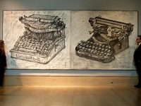 Members of staff poses with 'Large Typewriters', by South African artist William Kentridge, estimated at GBP350,000-550,000, during a press...