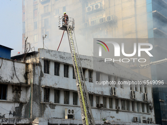 Firefighters try to extinguish a fire in a Bangladesh June Mills Corporation (BIMC) building at Motijheel Commercial area in Dhaka, Banglade...