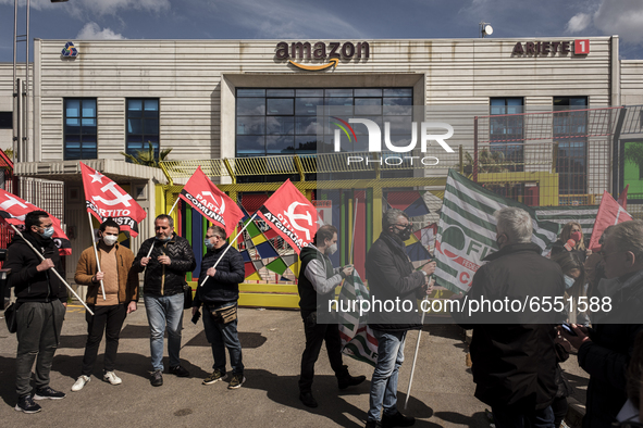 Members of the CISL, CGIL, UIL trade unions and some non-parliamentary party members gather outside the Amazon plant in Arzano in Naples, It...