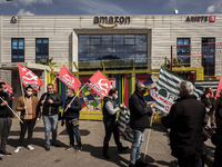 Members of the CISL, CGIL, UIL trade unions and some non-parliamentary party members gather outside the Amazon plant in Arzano in Naples, It...