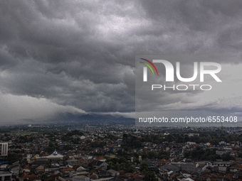 Black clouds cover Bogor, West Java, Indonesia, on March 24, 2021. The Meteorology, Climatology and Geophysics Agency (BMKG) predicts that t...