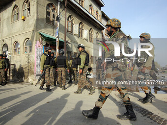 Indian soldiers arrive near the spot where suspected militants carried an attack on Indian paramilitary forces in Lawaypora on Srinagar outs...