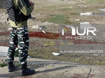 An Indian soldier stands near the spot where suspected militants carried an attack on Indian paramilitary forces in Lawaypora on Srinagar ou...