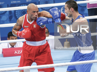 Valentino Manfredonia  of Italy (red) and Teymur
Mammadov of Azerbaijan (blue) compete for the gold medal in the Men's Boxing Light Heavywei...