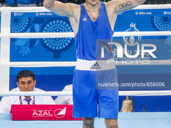 Teymur Mammadov of Azerbaijan (blue) reacts to the victory of  the gold medal in the match with Valentino Manfredonia  of Italy (red) valid...