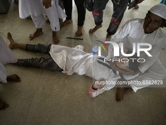 (EDITORS NOTE: Image contains graphic content) A person, who was injured in clashes, in Dhaka, Bangladesh on March 26, 2021 during a protest...