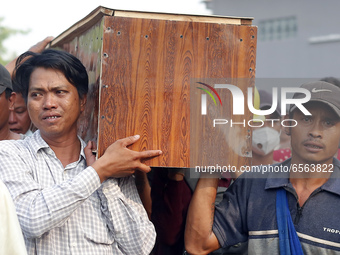 Mourners carry the coffin of Tin Hla, 43, who was shot dead by security forces during a protest against the military coup in Thanlyin townsh...