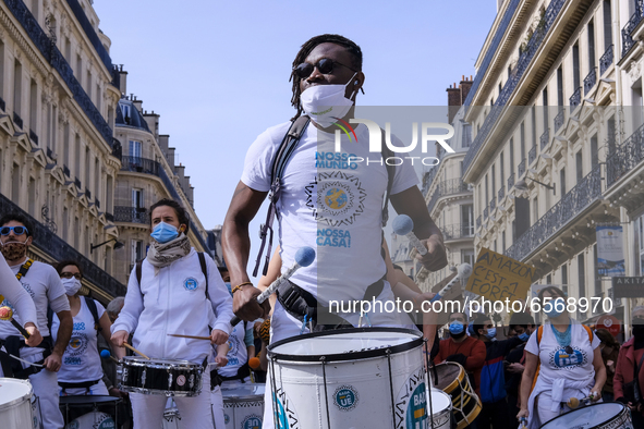Young demonstrators during the demonstration, march for the climate, and against the climate bill, in Paris, France on March 28, 2021. While...