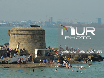 People enjoy nice sunny weather near Seapoint Beach, in Dublin, during level 5 COVID-19 lockdown. in Dublin during level 5 COVID-19 lockdown...