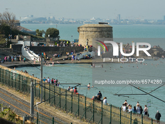 People enjoy nice sunny weather near Seapoint Beach, in Dublin, during level 5 COVID-19 lockdown. in Dublin during level 5 COVID-19 lockdown...