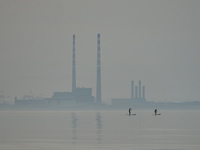 Two sailors practice paddleboarding at low tide near Dun Laoghaire West Pier, during level 5 COVID-19 lockdown. 
On Tuesday, March 30, 2021,...