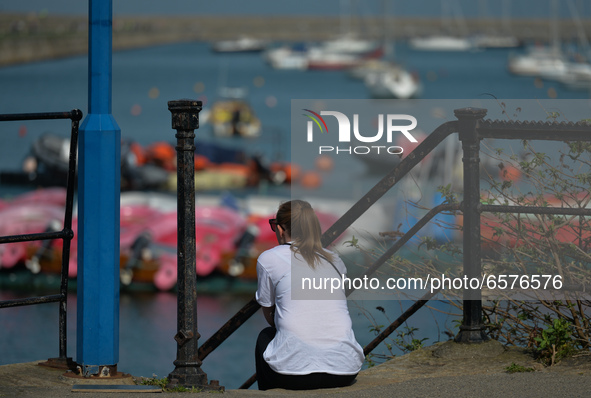 A woman enjoying nice sunny weather at Dun Laoghaire Harbour, during level 5 COVID-19 lockdown. 
On Tuesday, March 30, 2021, in Dun Laoghair...