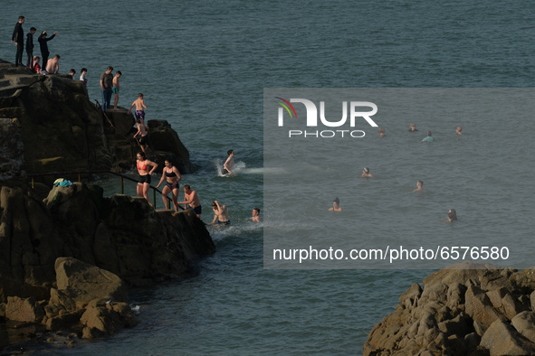 Swimmers enjoy jumping into the water at Forty Foot in Sandycove, Dublin, in fine sunny weather during level 5 COVID-19 lockdown. 
On Tuesda...