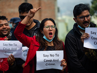 Nepalese student chants slogan during a protest against military coup in Myanmar in front of Myanmar Embassy in Lalitpur, Nepal on March 31,...
