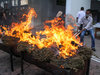 An Officer Prosecutor and Police are seen destroying evidence of marijuana by burning it in Lhokseumawe, on April 1, 2021, Aceh Province, In...