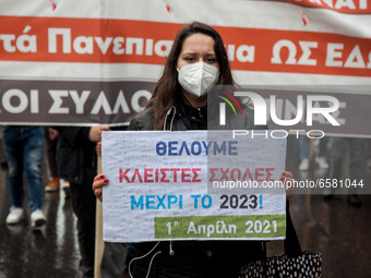 Students carry out a demonstration in a rainy day in Athens, Greece on April 1, 2021. (