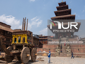 Nepalese devotees make the chariot of God Bhairab for the upcoming Bisket Jatra Festival at Bhaktapur, Nepal on April 01, 2021. (