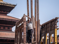 Nepalese devotees make the chariot of God Bhairab for the upcoming Bisket Jatra Festival at Bhaktapur, Nepal on April 01, 2021. (