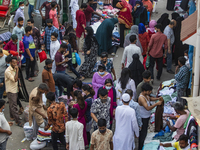Residents gather to buy their needs at New Market amid the COVID-19 coronavirus emergency in Dhaka, Bangladesh on April 2, 2021. (