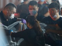 A bag of body and remains was sent to a morgue for identification and examination after a train carrying 490 people derails in a tunnel in H...