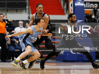 Kevin Pangos (L) of Zenit St Petersburg in action against William Howard and David Lighty (R) of LDLC ASVEL Villeurbanne during the EuroLeag...