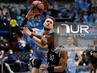 Mateusz Ponitka (L) of Zenit St Petersburg and Norris Cole of LDLC ASVEL Villeurbanne in action during the EuroLeague Basketball match betwe...