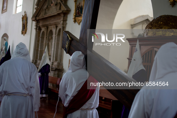 The Society of Nazarenes, meets inside the Tunja Cathedral to carry out the Viacrusis with the fourteen stations in which they pray and medi...