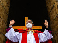 The Archbishop of Bogota, Monsignor Luis Jose Rueda, takes part in the representation of the Way of the Cross on Good Friday as part of Holy...