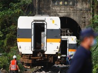 carriages of a train are being lifted and removed from a track after it derailed in a tunnel in Hualien on 2 April, in Hualien, Taiwan, 3 Ap...