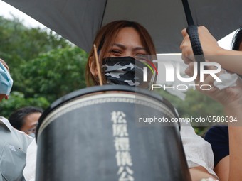 About a hundred people take part during a memorial ceremony mourning for the deaths of the train derailment, in Hualien, Taiwan, on April 4,...