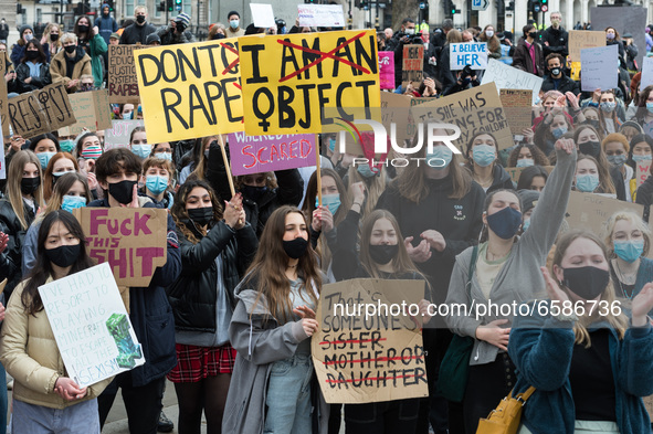 LONDON, UNITED KINGDOM - APRIL 03, 2021: Demonstrators take part in a protest in Parliament Square against violence towards women and the go...