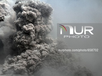 Mount Sinabung spews pyroclastic flow repeatedly fired hot clouds to the sky, as seen from the village of Tiga Serangkai, North Sumatra, Ind...