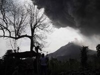 Mount Sinabung spews pyroclastic flows covered the sky into villages abandoned, as seen from the village of Berastepu, North Sumatra, Indone...