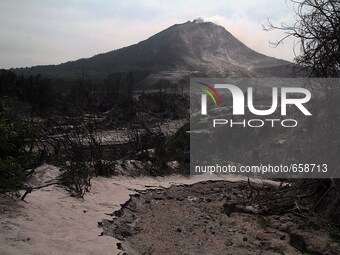 Sinabung volcano that burned villages abandoned the impact of the recent eruption, as seen from the village of Berastepu, North Sumatra, Ind...