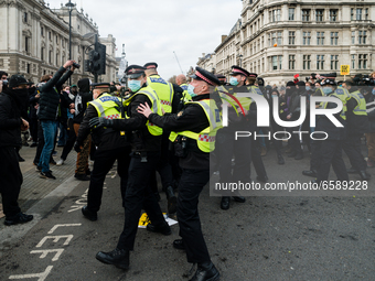 Police push protesters back in London, Britain, 3 April 2021. Protests around the United Kingdom have been held in opposition to the Police,...